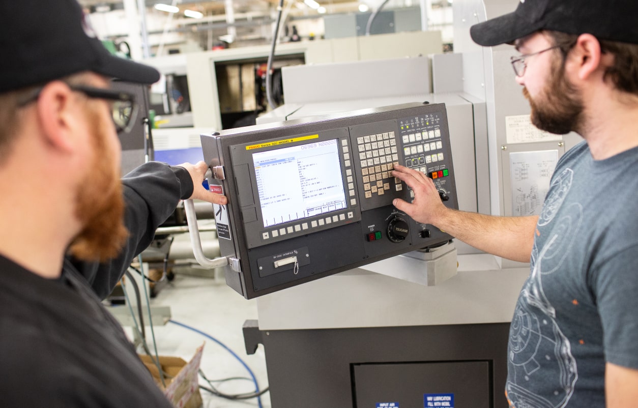 A Student and Advisor Working in the Lab.