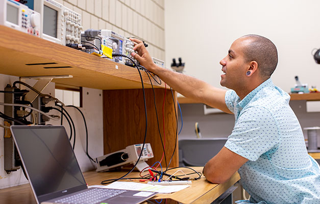 A Student Working with Technology in the Lab. 