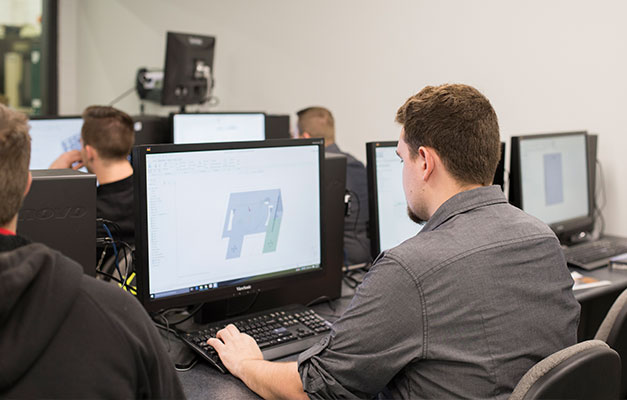 Machine Drafting Student Working on the Computer. 